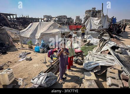 Displaced Palestinians Inspect Burned Tents Following Israeli Drone ...