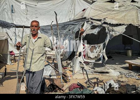 Displaced Palestinians Inspect Burned Tents Following Israeli Drone ...