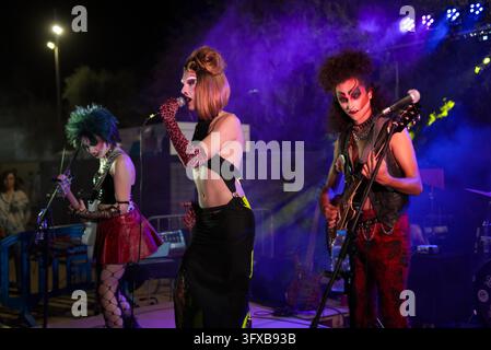 BARCELONA, SPAIN - 2023-09-09: A transgressive punk-inspired musical group performs live on stage under vibrant lights. Stock Photo