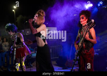 BARCELONA, SPAIN - 2023-09-09: A transgressive punk-inspired musical group performs live on stage under vibrant lights. Stock Photo