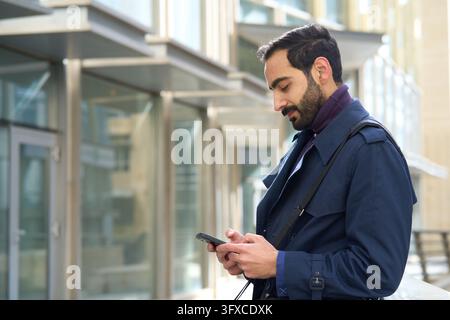Young arab businessman using a mobile phone Stock Photo