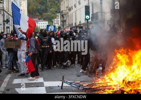 A fire burns in a public space during unrest in Lyon, France on October ...
