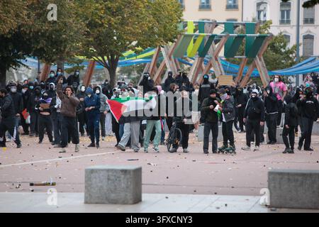 Demonstrators gather near a Palestinian flag during a protest in Lyon ...