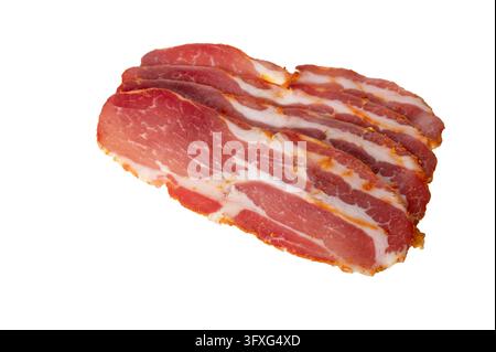 Thinly sliced traditional cured pork neck seasoned with red paprika, savory herbs, and aromatic spices, arranged on a clean white background. Premium Stock Photo