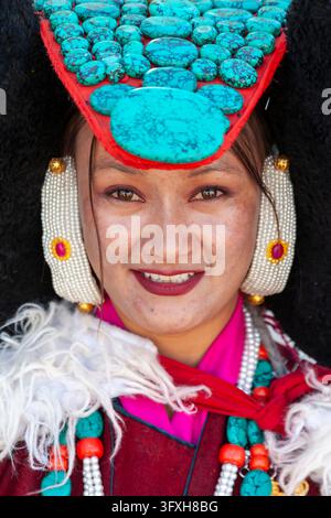 Portrait of a smiling Ladakhi woman wearing the Perak with turquoise stones, Ladakh, Leh, India Stock Photo