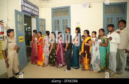 Constituency Example PATNA, INDIA - OCTOBER 23: Voters standing in queue for casting their ...