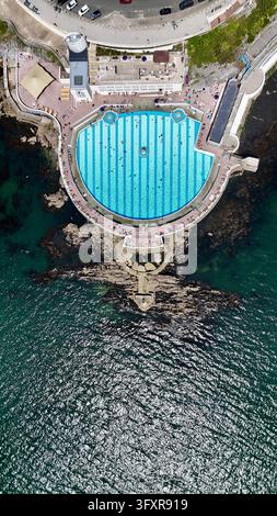 Top down aerial drone view of Tinside Lido outdoor swimming pool on Plymouth Hoe, Devon, England Stock Photo