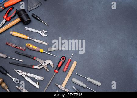 Set of Hand Tools on Dark Background copy space. Stock Photo