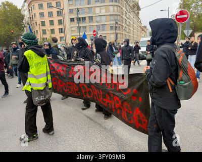 Demonstrators hold a banner reading 