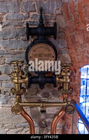Historic brewery valve and piping equipment exhibited at the Zywiec Brewery Museum in Poland. Stock Photo