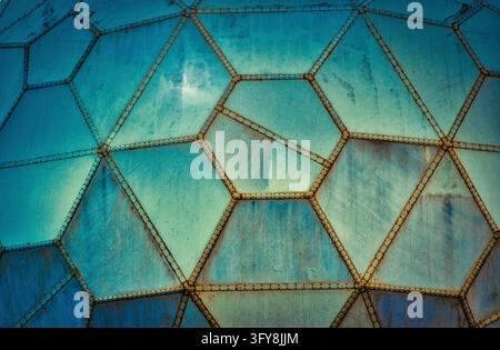 Blue futuristic grungy wall panels made of geometric shapes Stock Photo