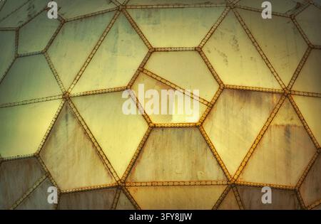 Yellow futuristic grungy wall panels made of geometric shapes Stock Photo