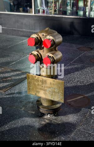 Holywood United States October 23 2026 A weathered brass standpipe and sprinkler connection stands on a city sidewalk Stock Photo