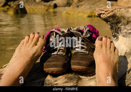two bare feet beach shoes