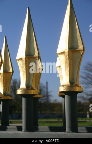 Gold topped railings in Tuileries gardens, Eiffel Tower in Background ...