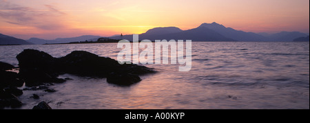 Skye sunrise looking across the Sound of Sleat to Isleornsay lighthouse Stock Photo