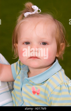 Portrait of 14 Month Old Baby Girl Being Held by Female in Park La Jolla California Stock Photo