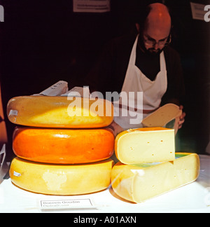 Boeren Goudse Oplegkaas round of cheese selling on a cheese stall at Spitalfields Market, London, UK  KATHY DEWITT Stock Photo