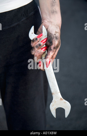 Woman holding spanner close up Stock Photo