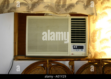 Interior of urban bed room air conditioner fitted on wall Ahmedabad Gujarat India Stock Photo