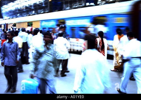 Local suburban electric train rushing commuters leaving Churchgate Railway Station in Bombay now Mumbai Maharashtra India Asia Stock Photo