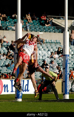 Players jumping to mark (catch) the ball in Australian Rules Football match, Subiaco, Western Australia 2006 Stock Photo