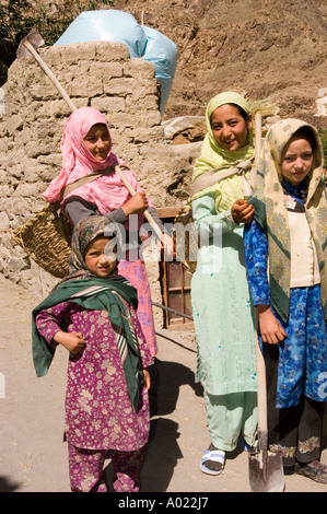 A group of young Muslim Dard or Brokpa girl in color clothes looking at camera in Sunjak village Ladakh Kashmir India Stock Photo