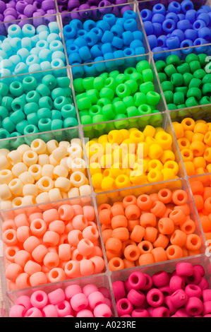 Compartments with different colored beads Stock Photo