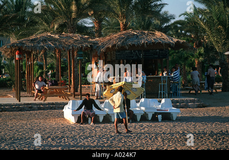 Egyptian staff at the coastal resort of Nuweiba looking after the beach area and watersports equipment Egypt Stock Photo