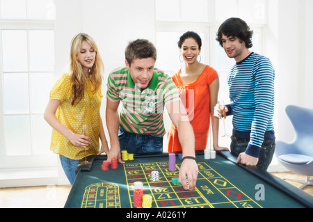 Friends Gambling on roulette table Stock Photo