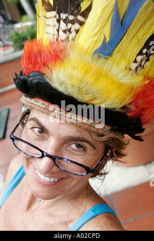 Miami Florida,Coconut Grove,Mad Hatter Arts Festival,festivals,celebration,fair,smiling woman,feathers,hat,visitors travel traveling tour tourist tour Stock Photo