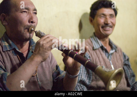 Ladakhi man playing traditional music instrument Surma trumpet Ladakh ...
