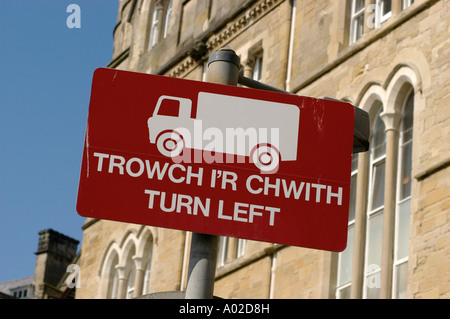 aberystwyth bilingual welsh english turn left street sign [Trowch i'r Chwith] with icon of truck, Wales UK Stock Photo