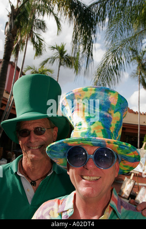 Miami Florida,Coconut Grove,Mad Hatter Arts Festival,festivals,celebration,fair,mature couple,hats,visitors travel traveling tour tourist tourism land Stock Photo