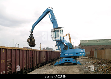 Fuchs MHL 350 loader unloading scrap metal from a train in the uk Stock Photo