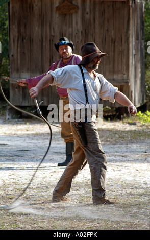 Cowboy cracking a stockwhip Whip cracking demonstration at Silver River State Park in Ocala central Florida America USA Stock Photo