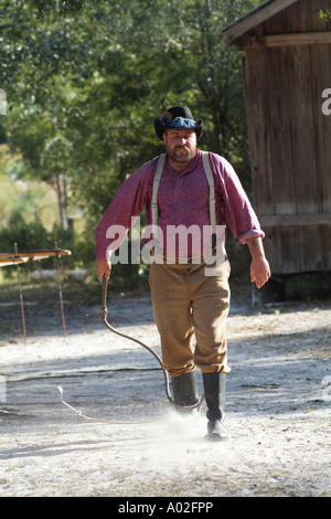 Cowboy cracking a stockwhip Whip cracking demonstration at Silver River State Park in Ocala central Florida America USA Stock Photo