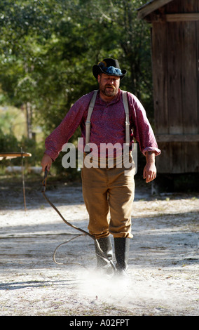 Cowboy cracking a stockwhip Whip cracking demonstration at Silver River State Park in Ocala central Florida USA Stock Photo