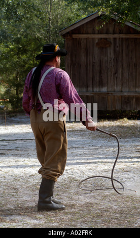 Cowboy cracking a stockwhip Whip cracking demonstration at Silver River State Park in Ocala central Florida USA Stock Photo