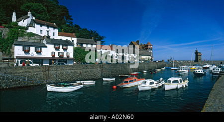 Panoramic view of small boats at anchor in Lynmouth Harbour with thatched cottages above in North Devon England Stock Photo