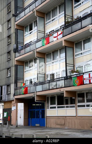 England's Cross of St. George and Portugal flags flying from block of flats in South London during 2006 World Cup Finals Stock Photo