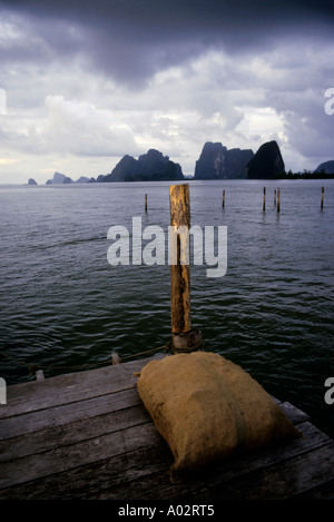 Thailand phang nga bay rice bag on a quay with a view over the lime stones islands Stock Photo