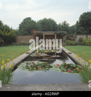 Long rectangular pool with Nymphaea in large country garden Stock Photo