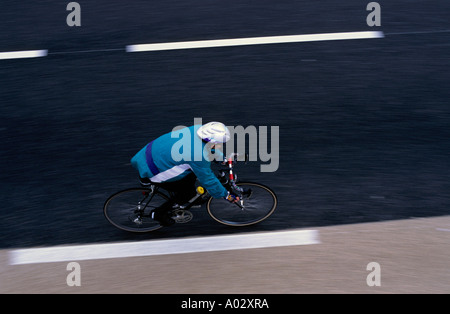 Cyclist riding a mountain bike on a road, Gineste Pass, Marseille, France. Stock Photo