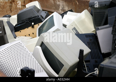 computer monitors in a skip Stock Photo