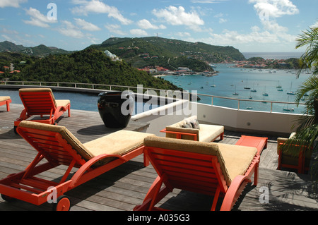 Saint Barth St Barts Private rental Villa Pool lounge chairs overlooks Gustavia Harbor Caribbean sea Stock Photo