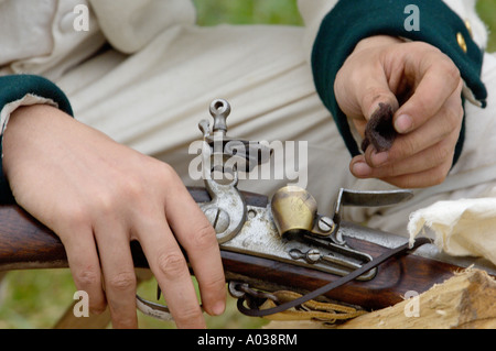 French soldier cleaning his musket at a reenactment on the Yorktown Battlefield Virginia. Digital photograph Stock Photo