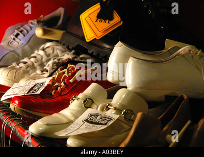 Variety of used shoes for sale at a consignment shop. Stock Photo