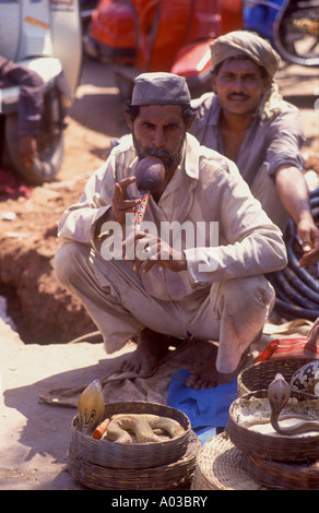 Goa -  Snake charmer at a market in the north Goan town of Mapusa Stock Photo