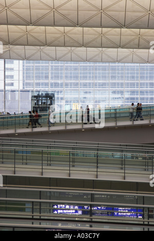 Passengers Walking Along Ramps At Hong Kong International Airport Stock ...